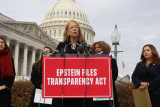 Rep Morrison stands at podium outside Capitol. Sign on podium reads "Epstein Files Transparency Act"
